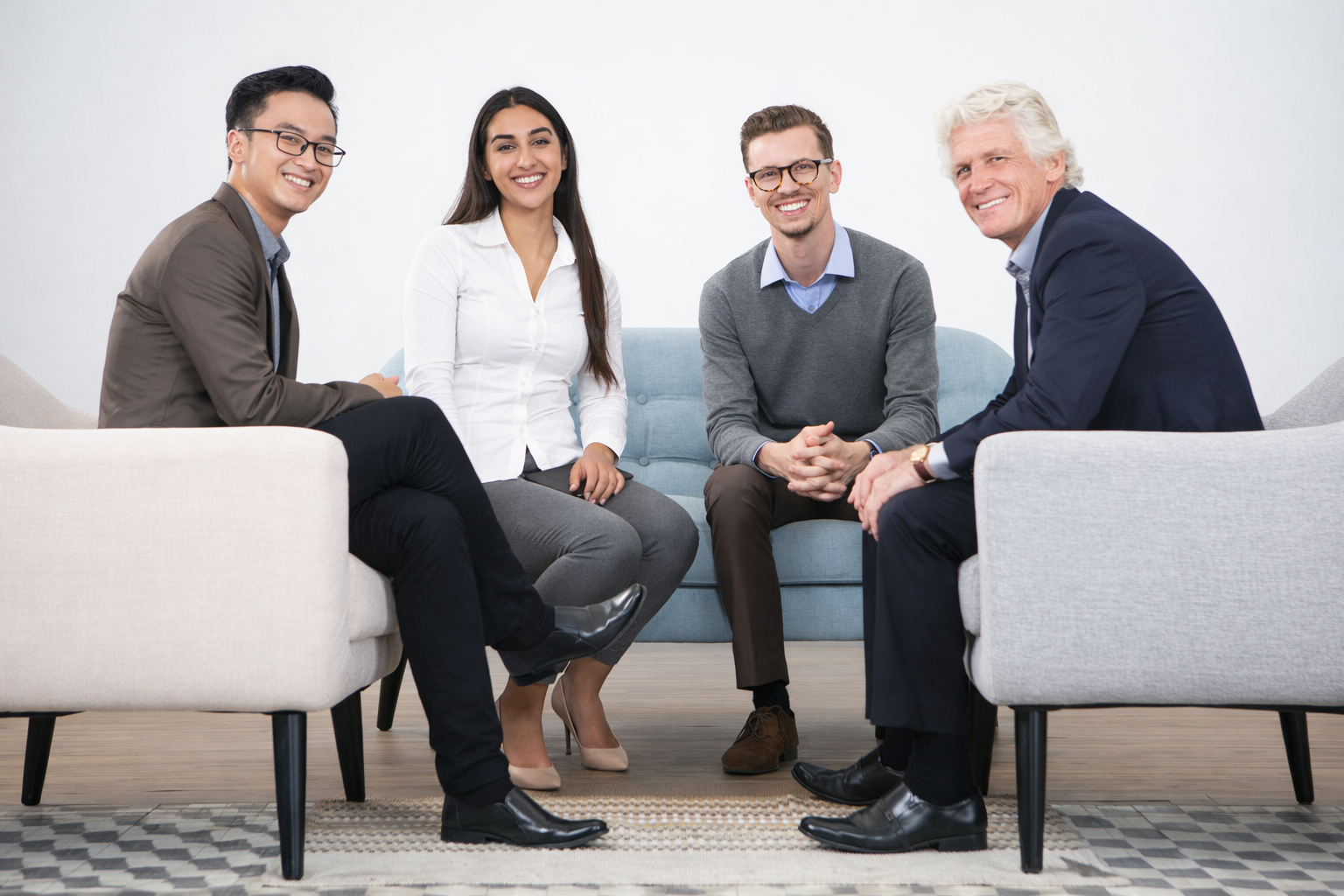 A team of smiling counselors looking into the camera.